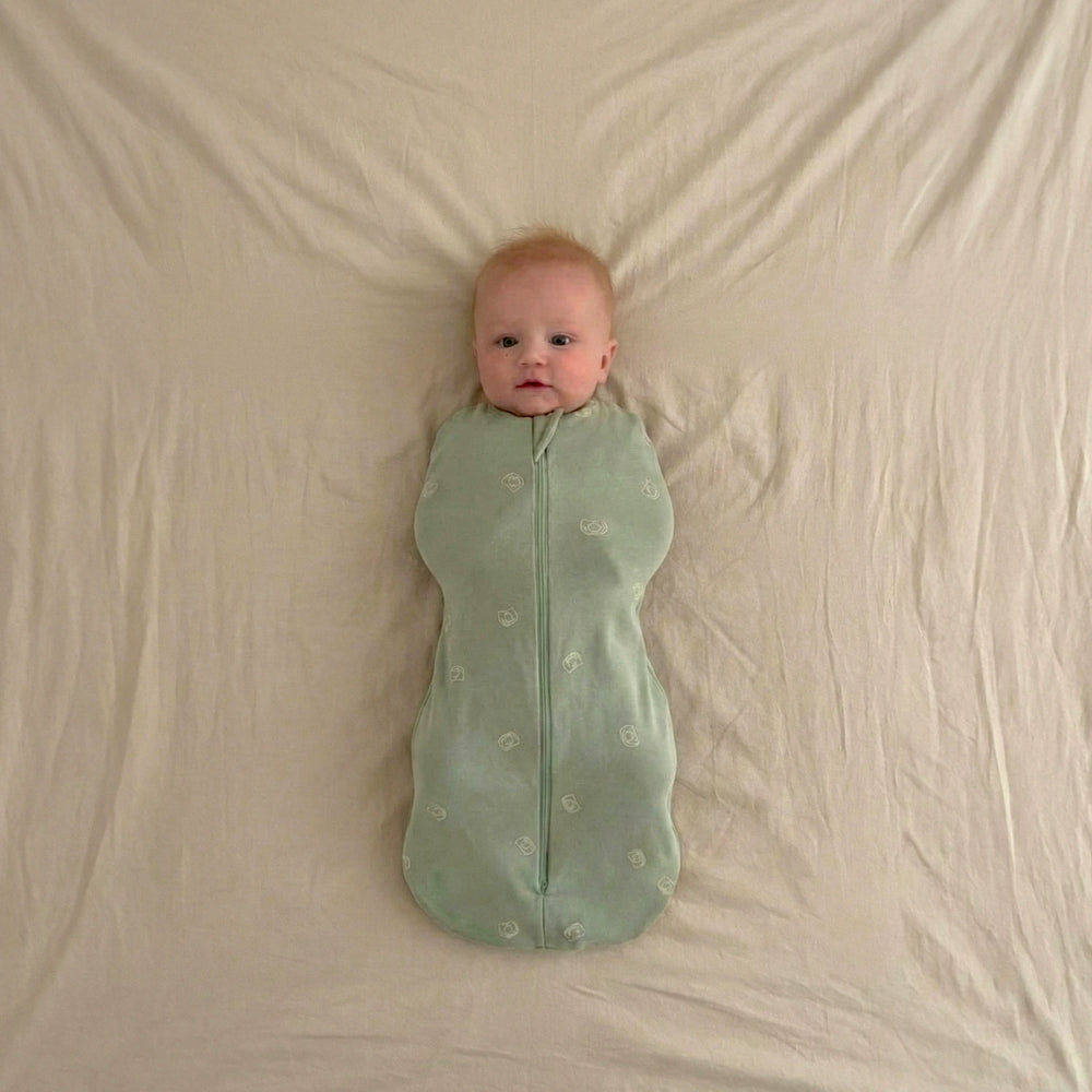 baby wearing 0.2 TOG sleep swaddle sack sage green